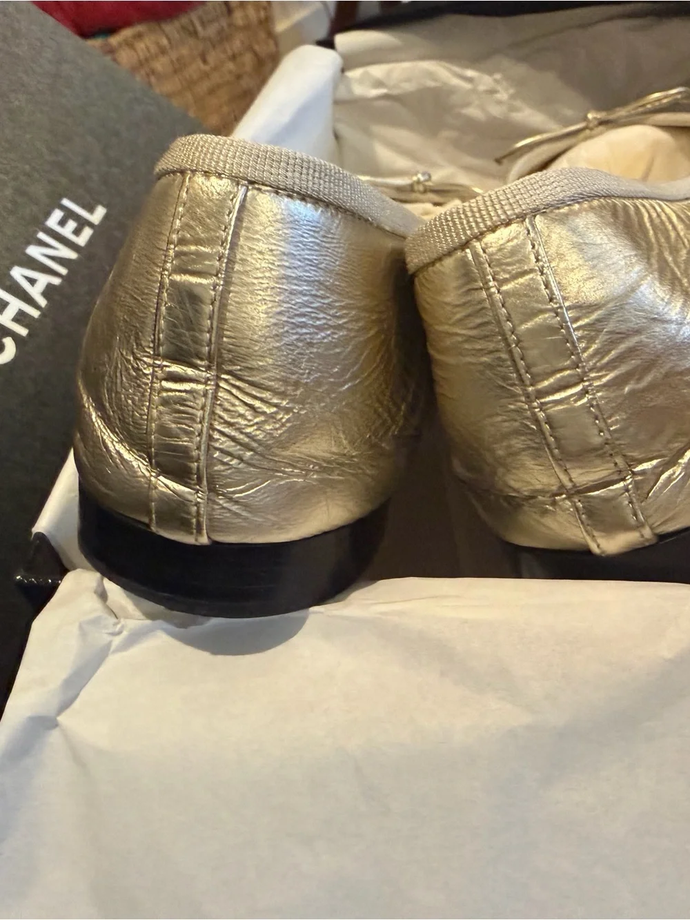 CHANEL Gold Leather Ballet Flats with Black Cap Toe Winter 2025 Season